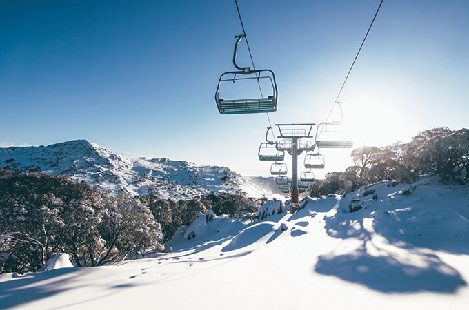 Gondola or aerial lift at the Perisher Ski Resort in New South Wales with snowy mountains during daytime