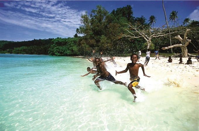 Vanuatu kids playing in water