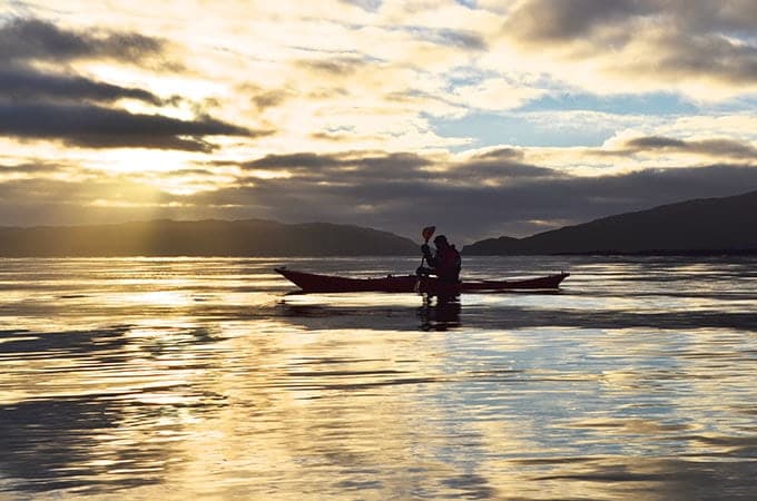 Kayaking along the sparkling coastline of Scotland