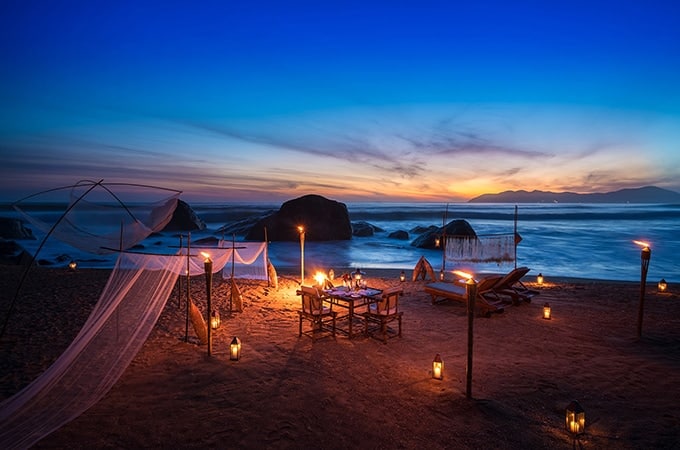 Banyan Tree Lăng Cô - romantic beachfront setup during sunset