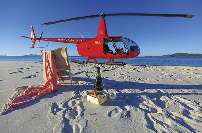 Hitch a helicopter ride to Whitehaven Beach for a thrilling adventure