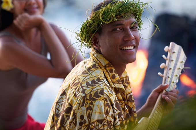 Man in Tahiti playing ukelele
