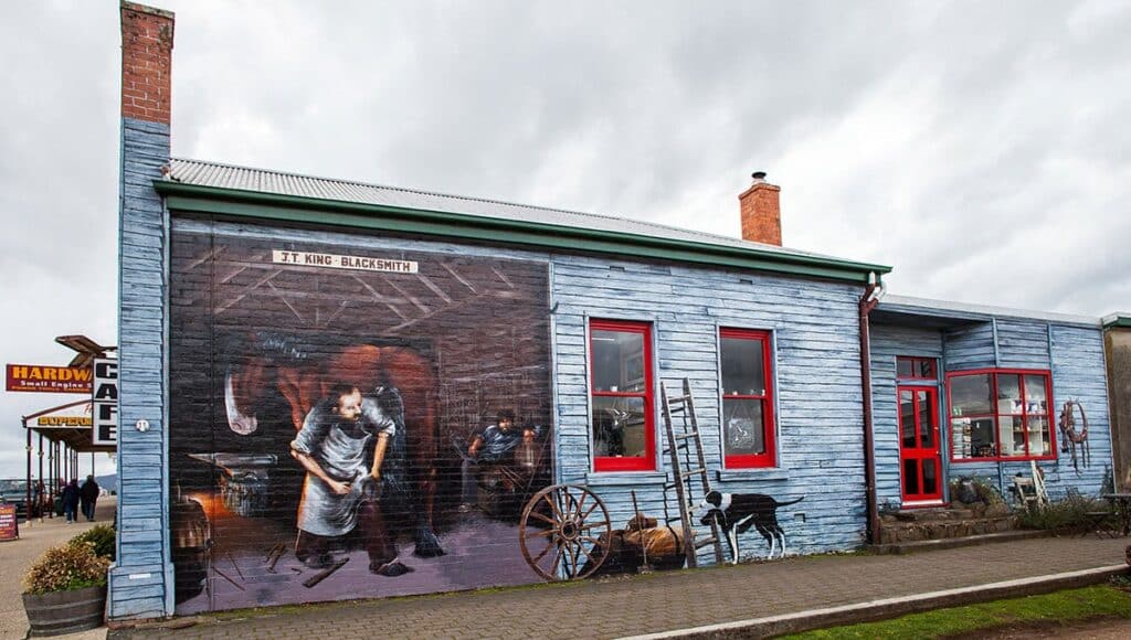 An exterior shot of a building with a mural or painted wall at Sheffield, Tasmania