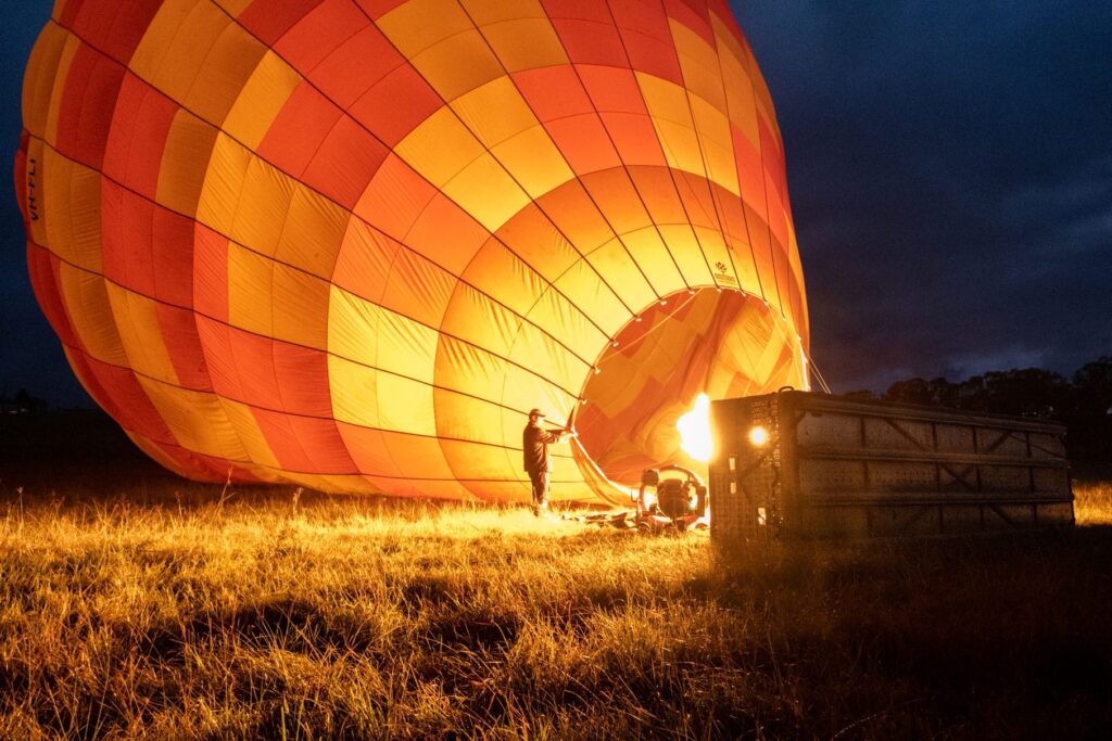 Inflating a hot-air balloon in The Gold Coast Hinterland during nighttime
