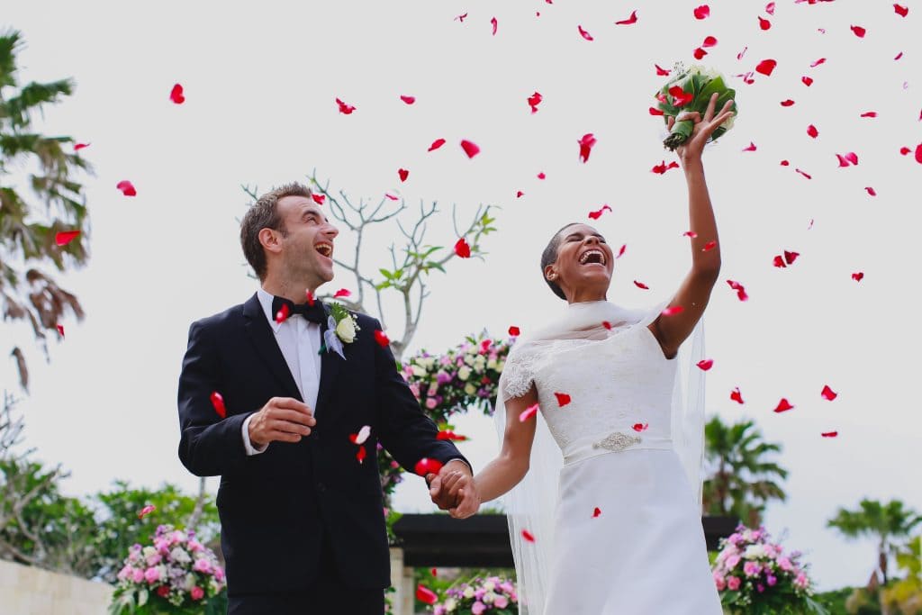 the-bale-nusa-dua-bali-newlyweds-celebrating-with-flower-petal-confetti