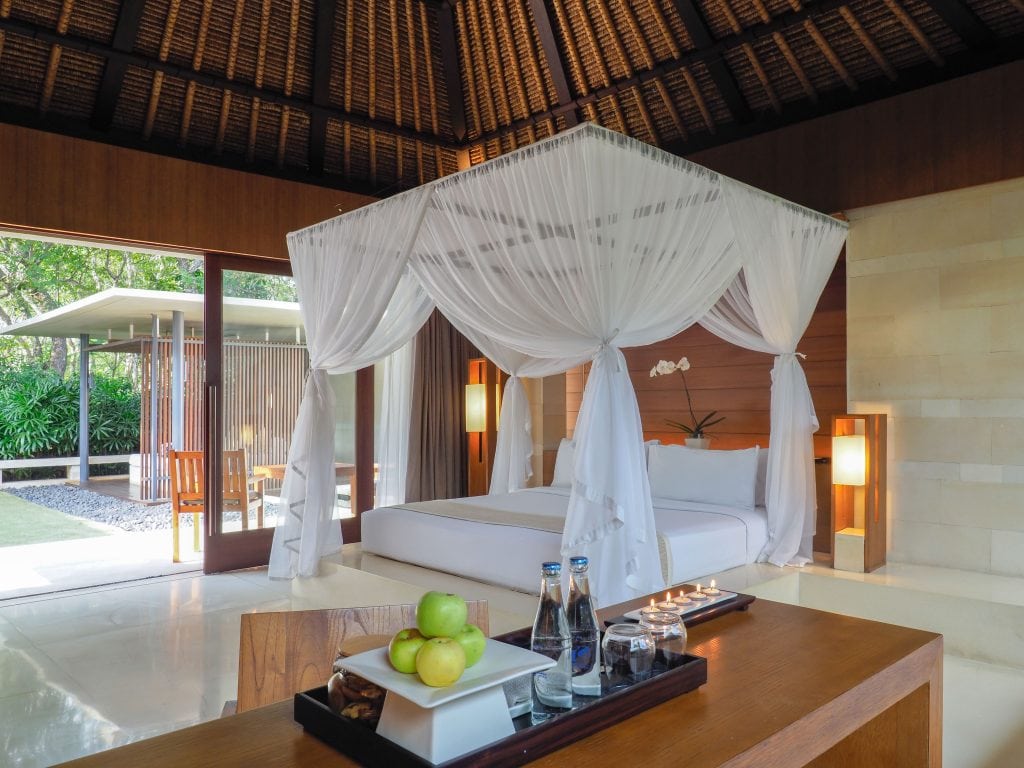 the-bale-nusa-dua-bali-single-pavilion-view-of-the-interior-with-bed-during-daytime
