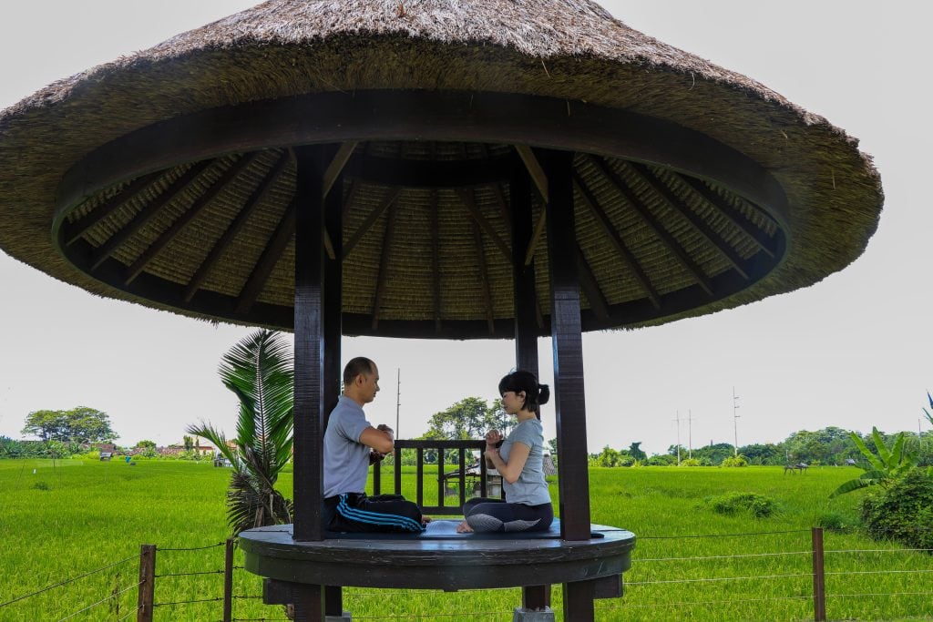 The-Samata-Sanur-Bali-couple-meditating-in-a-hut