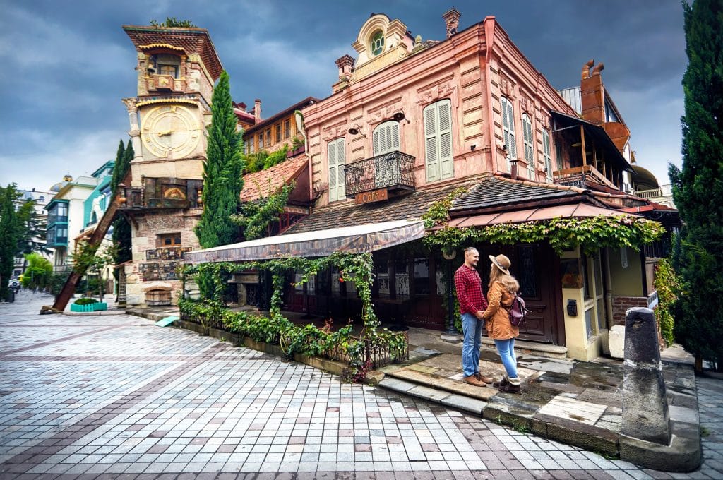 Europe-Tbilisi-Georgia-couple-holding-hands-in-front-of-an-old-cafe