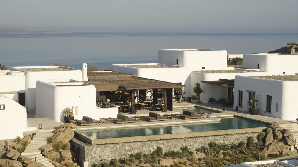 Drone shot of the main pool, restaurant, and bar at Kalesma Mykonos Greece