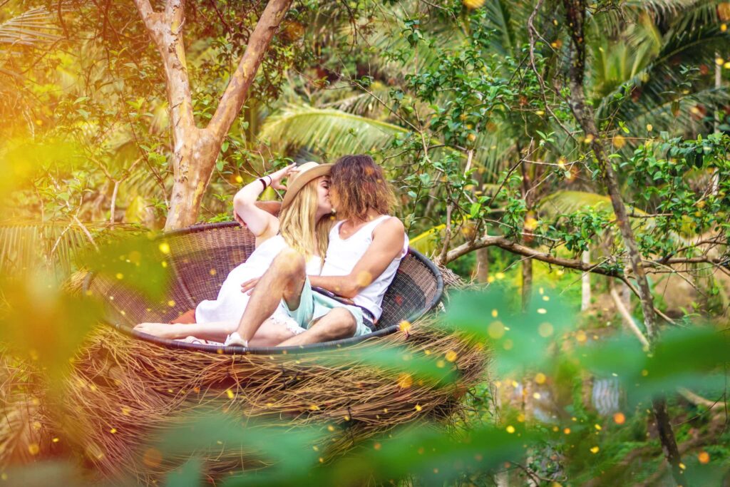 Couple kissing in bamboo nest, Ubud, Bali