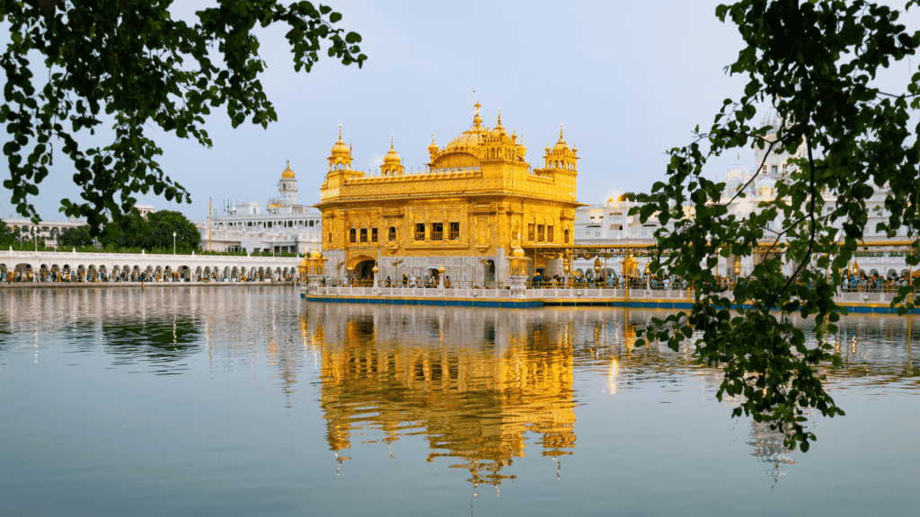 Sri Harmandir Sahib temple in Amritsar, India reflected in the lake - Golden Temple