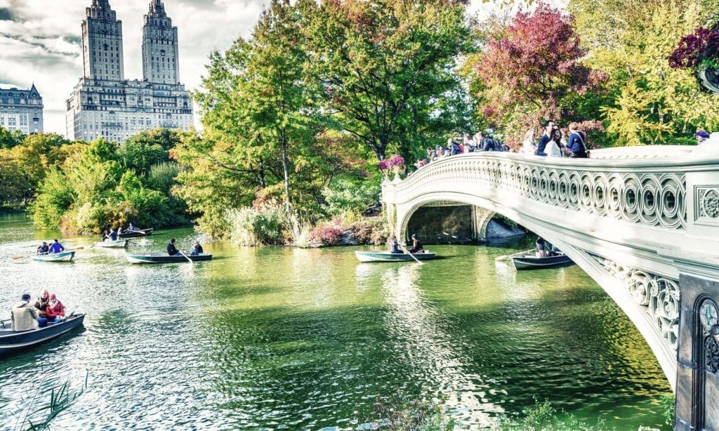 tourists in boats cetral park new york