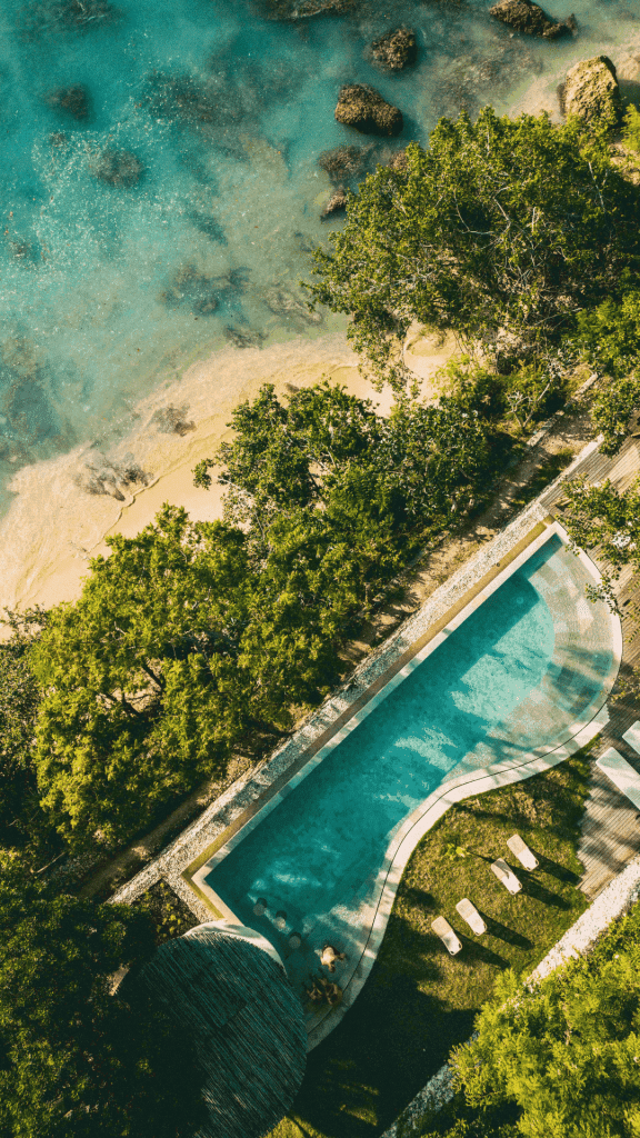 Morin Resort, Nusa Lembongan, Bali - Drone shot of the pool with views of the beach